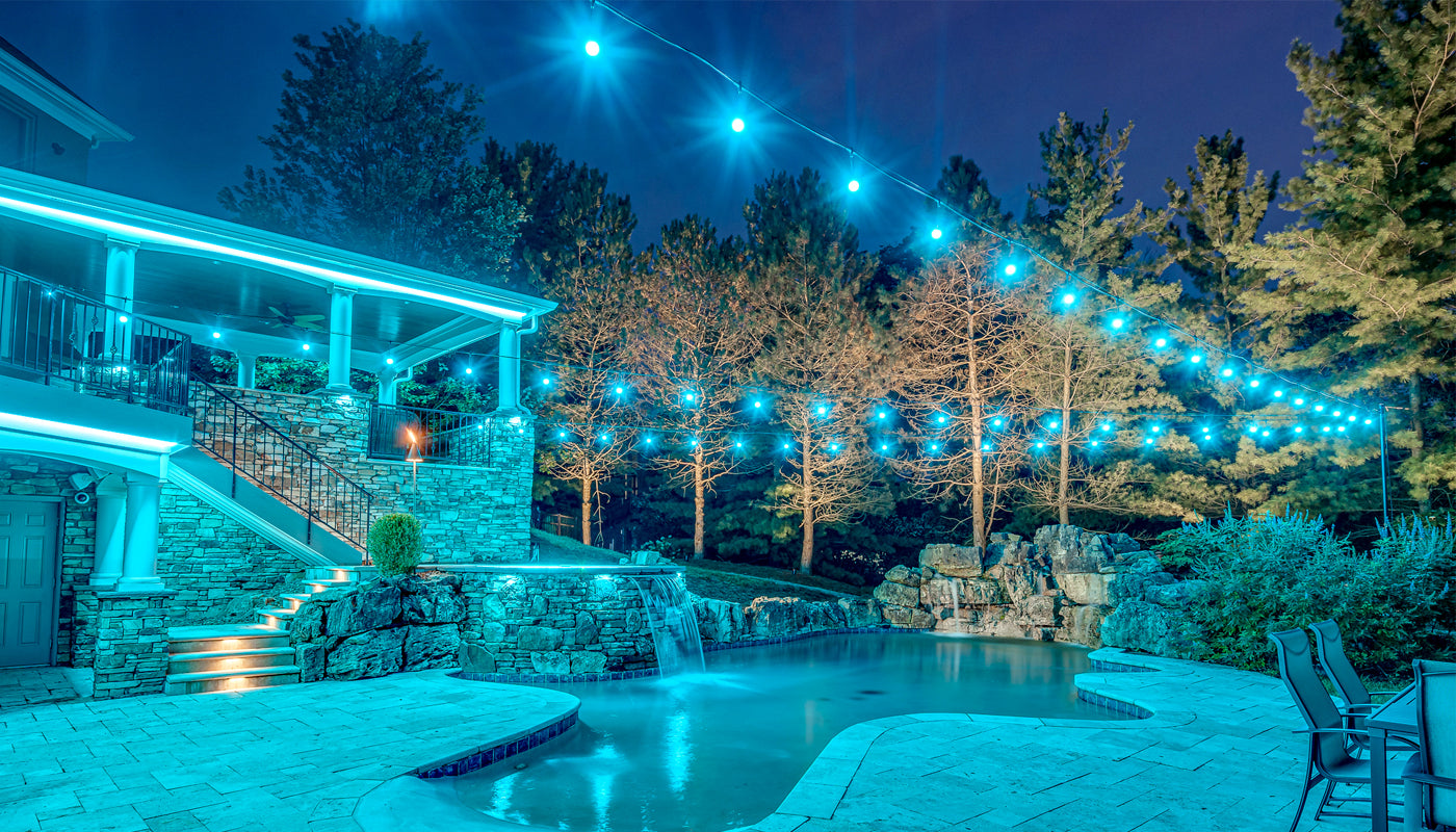 backyard string lights with color in upscale home