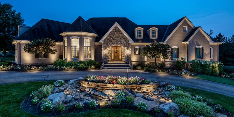 classic white wireless outdoor lighting on luxury home