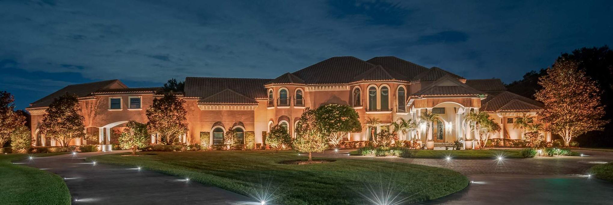 House with Low Voltage Landscape Lighting at Night