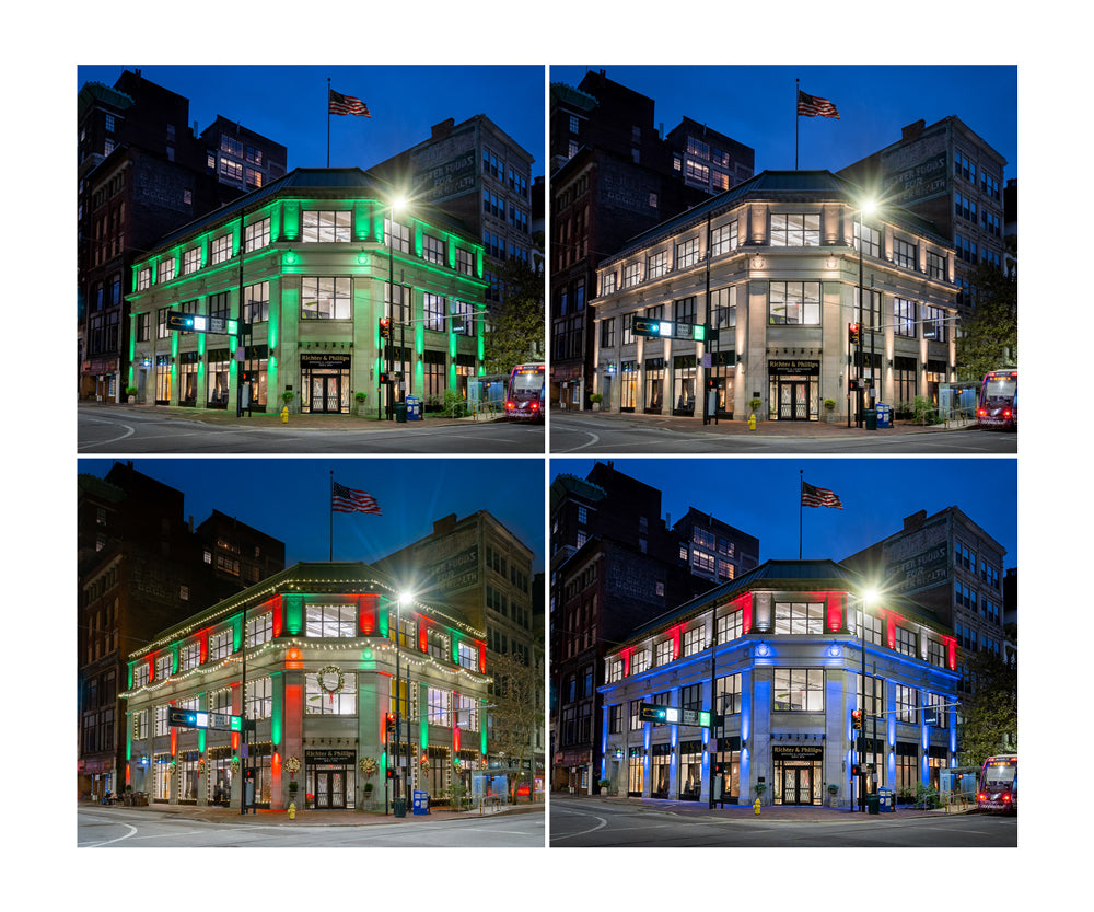 commercial building with outdoor lighting on shown in green, white, Christmas lighting, and red, white, and blue for the Fourth of July