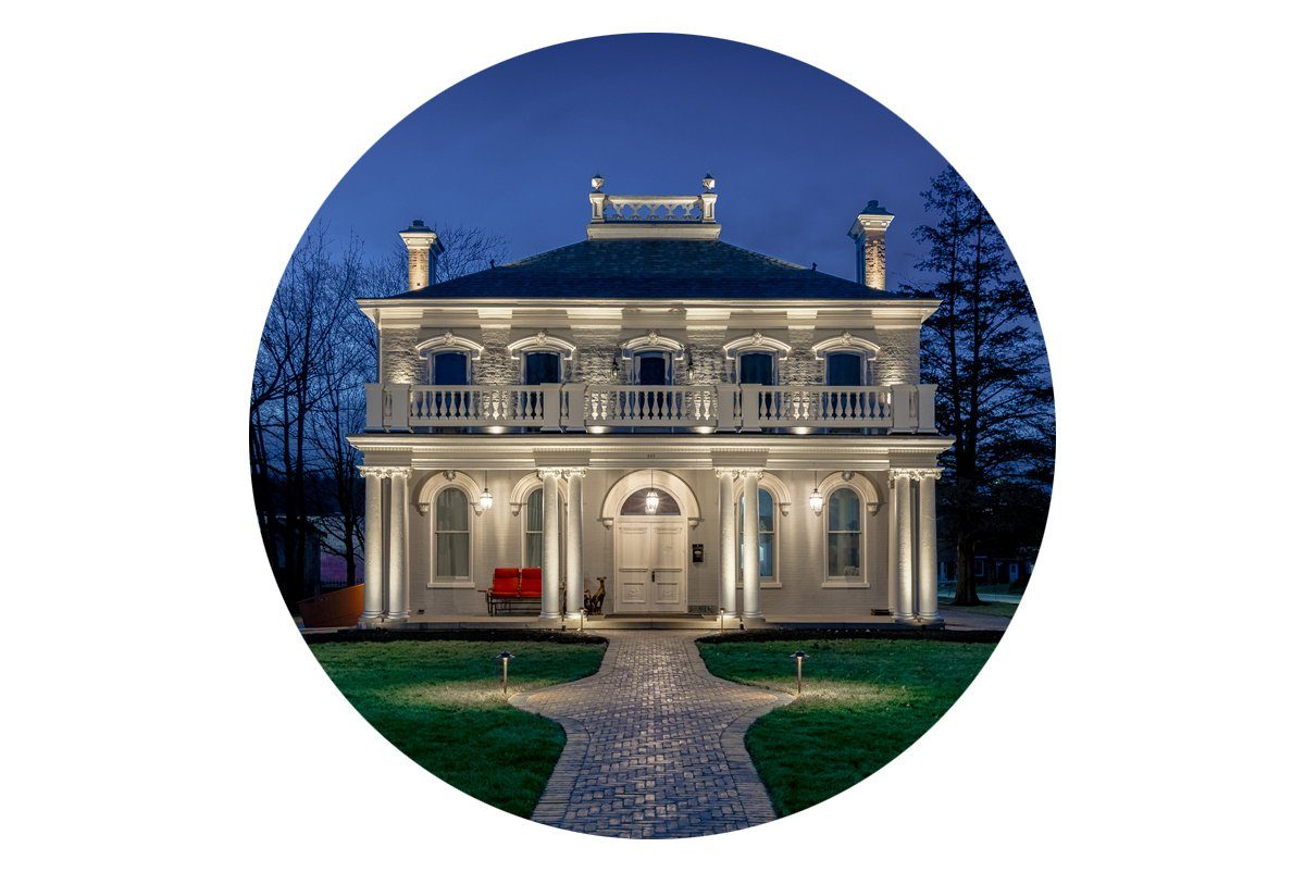 white house illuminated with help from Stratus smart landscape lighting transformer